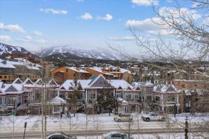 a town covered in snow with houses and cars at Tannhauser 313 in Breckenridge