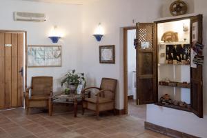 a room with a table and two chairs and a table and a table at Hotel Los Castaños in Cartajima