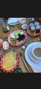 a wooden table with plates of food on it at Riad Lile Fes in Fez