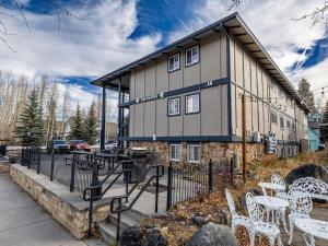 a building with white chairs in front of it at Edelweiss 12 in Breckenridge