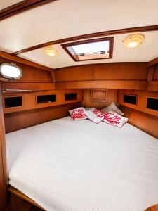 a bed in the back of a boat at Che Manovra - A Night Onboard! in Porto San Paolo