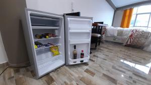 a refrigerator with its door open in a room at Hotel el sol Caraz in Caraz