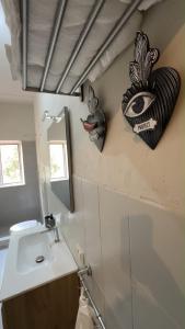 a bathroom with a sink and a mirror on the wall at Dimora Corso Roma in Montecatini Terme +7 photos
