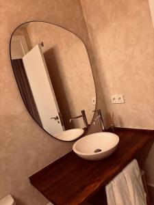 a bathroom with a sink and a mirror at Kanaloa Lodge in Galizano +52 photos