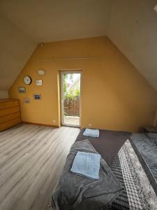 a bedroom with a large bed and a large window at Sea House in Puck Free Parking in Puck