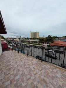 a balcony with a view of a body of water at Vila Manila in Eforie Nord
