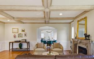 a living room with a couch and a fireplace at Spacious Proctor Tudor-Sleeps 16-Dog Friendly-Walk in Tacoma