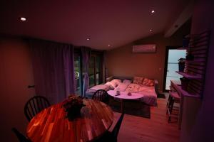 a living room with a couch and a table at Casa Lilou in Lochristi