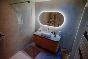 a bathroom with a sink and a mirror at Casa Lilou in Lochristi +24 photos