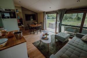 a living room with a couch and a table at Casa Lilou in Lochristi
