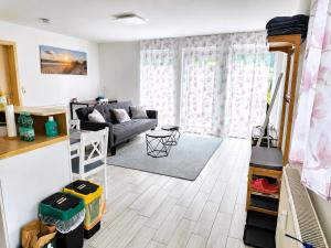 a living room with a couch and a table at Ferienwohnung Varli in Tuttlingen