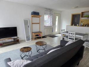 a living room with a couch and a table at Ferienwohnung Varli in Tuttlingen
