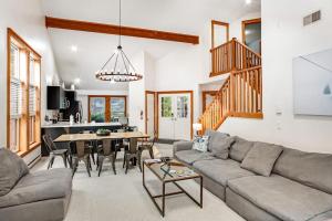 a living room with a couch and a table at House Juniper in Tannersville