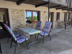 a table and chairs sitting on a patio at Casa Vacanza in Serravalle delle Langhe