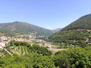 a view of a village in the mountains at Casa do Patrão Serradalto in Manteigas