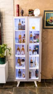 a white refrigerator filled with lots of drinks at Villa Mali Raj in Čapljina