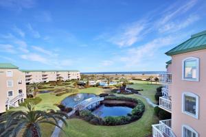 an aerial view of a resort with a pool and palm trees at St. Simons Grand 307 in Saint Simons Island