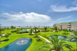 an aerial view of a resort with a pool and palm trees at St. Simons Grand 307 in Saint Simons Island