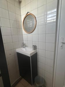 a bathroom with a sink and a mirror at Ti Francois in Le François