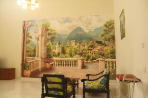 a wall mural of a balcony with a castle at kluanghomestayvilla in Kluang