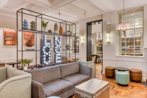 a living room with a couch and a table at hub London Farringdon - Old Bailey in London