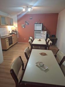 a kitchen with a table and chairs in a room at Naab-burg in Nabburg