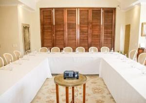 a room with a table with white tables and chairs at Homestead Villas in Bellville +53 photos