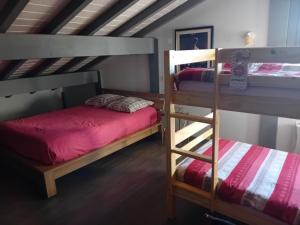 a bedroom with two bunk beds and a ladder at Maison de montagne Hautes Vosges- 12 Pers-Nature-Randonnée- VTT in Le Thillot