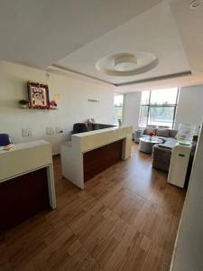 a room with a kitchen and a living room at SLV Royal Residency Hotel in Bidadi +10 photos