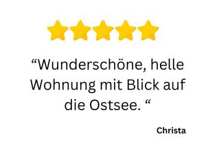 four yellow stars with the words winospherephrine hello walking at Huus Binnensee OG2 - Dachwohnung mit Wasserblick - Lesesessel & WLAN - Für Paare - Ruhige Lage - Südstrand 5 Min mit Rad in Fehmarn
