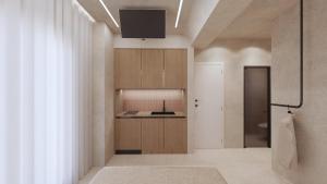 a room with a bathroom with a tv on the ceiling at Pharos by Premium Key in Skiathos