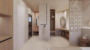 a kitchen with a refrigerator in the middle of a room at Pharos by Premium Key in Skiathos