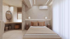 a bedroom with a bed and a mirror at Pharos by Premium Key in Skiathos