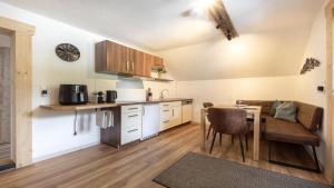 a kitchen with a table and a dining room at Haus Georg in Leutasch