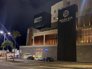 a building with a sign on the side of it at Hotel Plaza Sol Veracruz in Veracruz