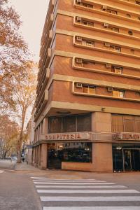 a building on a street in front of a building at Eleven Palace Hotel in Buenos Aires