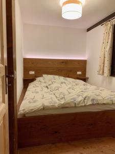 a bedroom with a bed in a room at Ferienpark Vorauf Fepark 53 in Siegsdorf