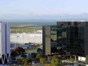 an aerial view of a large office building at Pullman Auckland Airport in Auckland +46 photos