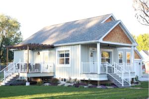 a white house with a gambrel roof at The Harkness Hotel in McCammon