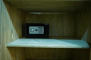a small microwave sitting on a shelf in a room at Pyramids Hostel in Cairo