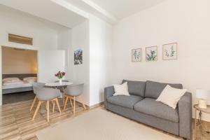 a living room with a couch and a table at cityswap- Wien 2 District in Vienna