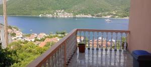 a balcony with a view of a body of water at Apartman Laura 3 in Kamenari