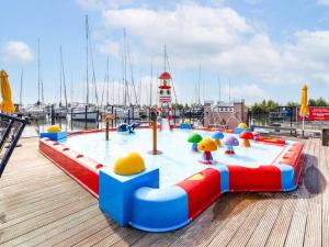 a playground on a boat with a water park at Boot zonder naam in Volendam