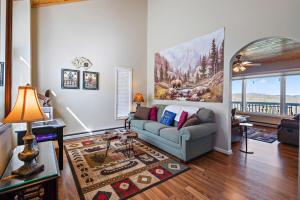 a living room with a couch and a painting on the wall at A Place Apart in Blowing Rock