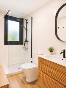 a bathroom with a toilet and a sink and a shower at Airtegal Dunas de Cedeira in Cedeira +10 photos