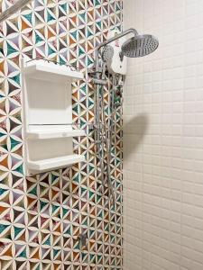a shower in a bathroom with a mosaic tile wall at Hatyai marina Villa in Ban Khlong Hae +39 photos