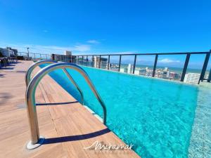 a swimming pool on the roof of a building at Move - Tambaú in João Pessoa
