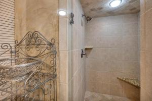 a bathroom with a shower and a sink at Beach Club 436 in Saint Simons Island