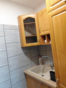 a small bathroom with a sink and a shower at Kawalerka nad Odrą in Brzeg