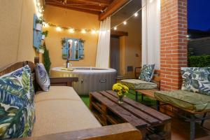 a patio with a bench and a bath tub at Casas Rurales Florentino in Robledillo +43 photos